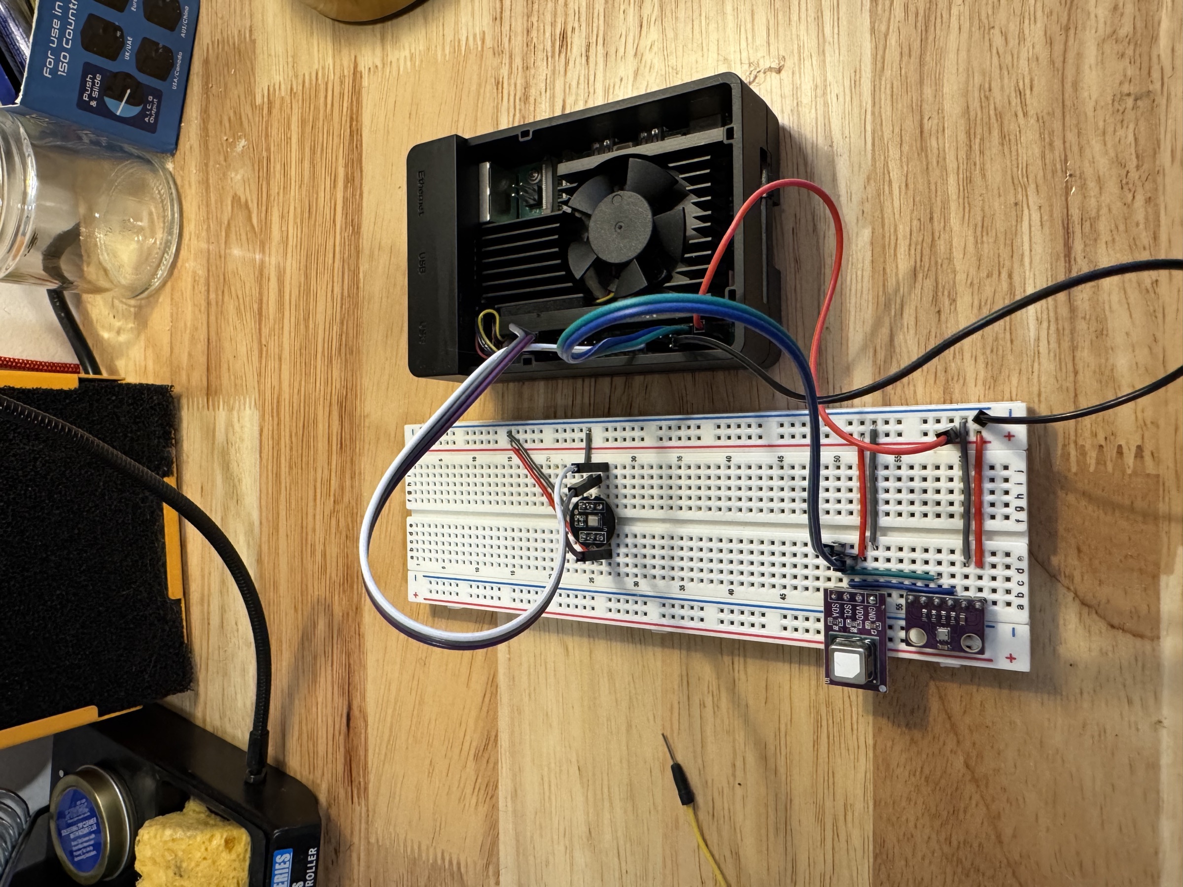 The Raspberry Pi connected to a breadboard with the BME280, SCD40, and INMP441